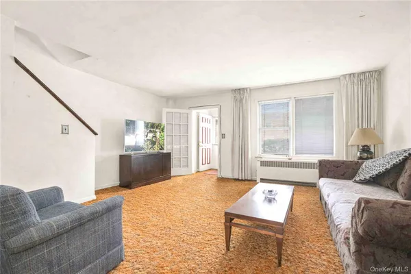 a living room with furniture and a couch