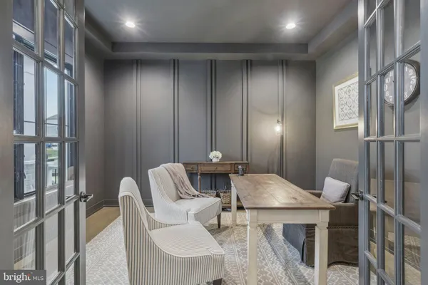 a view of a dining room with furniture and a chandelier