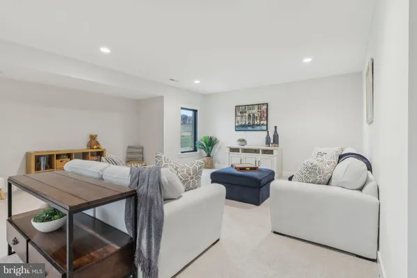 a living room with furniture and a table