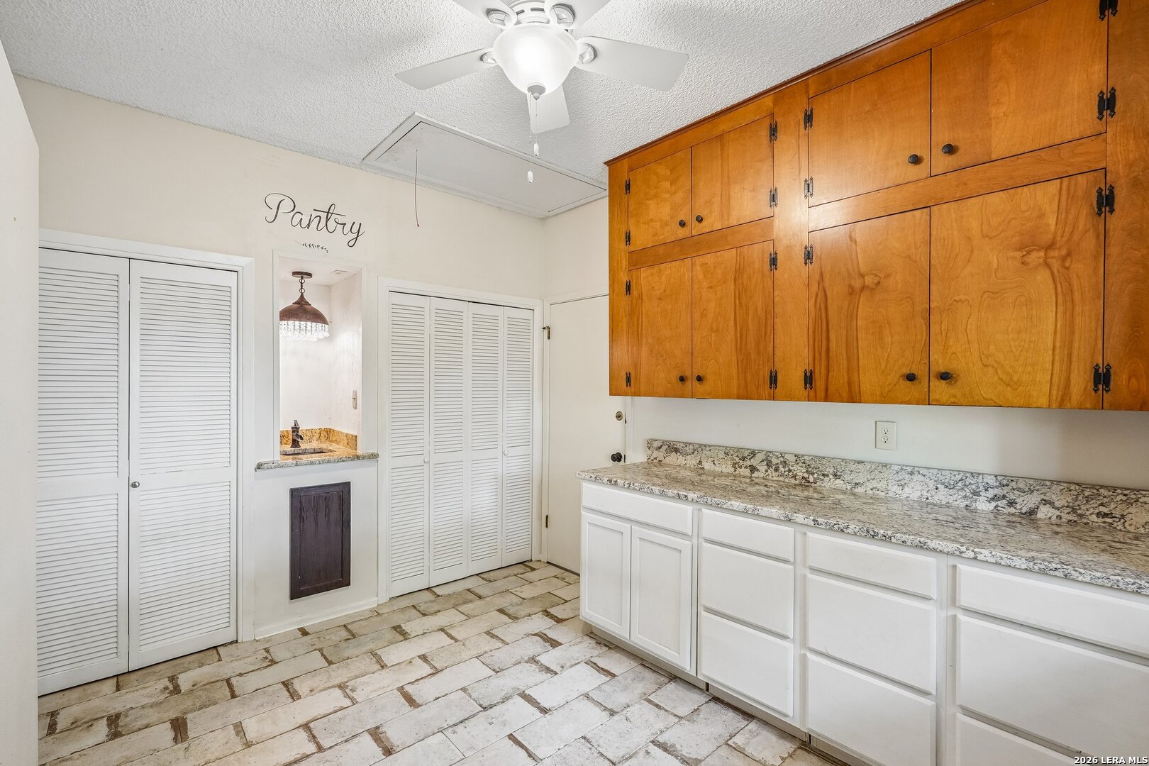 20632 Timber Rose Drive Garden Ridge, TX 78266 - Photo 30 of 46 a kitchen with stainless steel appliances granite countertop a sink and a refrigerator