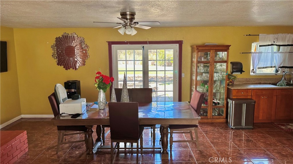 21290 Ellis Avenue Perris, CA 92570 - Photo 12 of 47 a view of a dining room with furniture window and outside view
