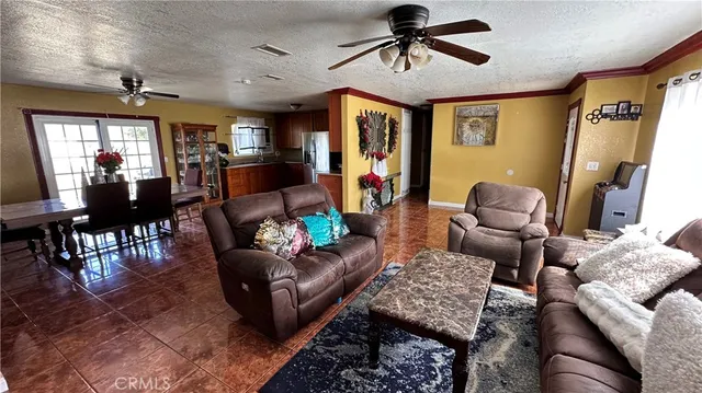 a kitchen with stainless steel appliances granite countertop a refrigerator stove and sink