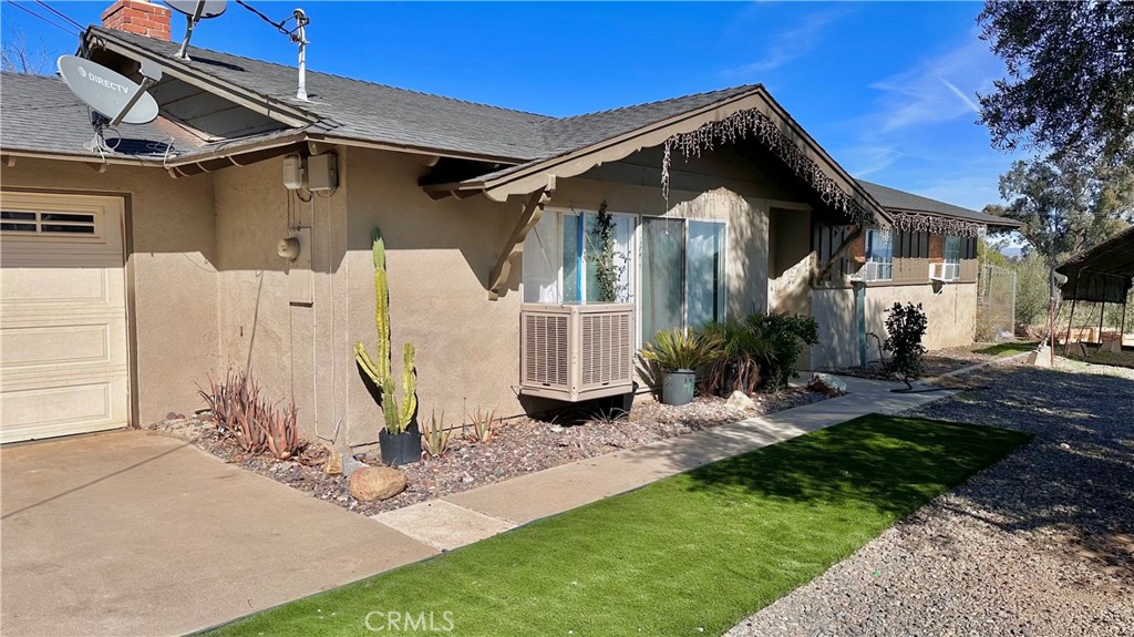 21290 Ellis Avenue Perris, CA 92570 - Photo 4 of 47 a view of a house with a yard