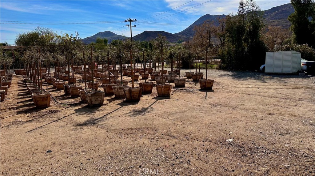 21290 Ellis Avenue Perris, CA 92570 - Photo 41 of 47 a view of a terrace with a bench