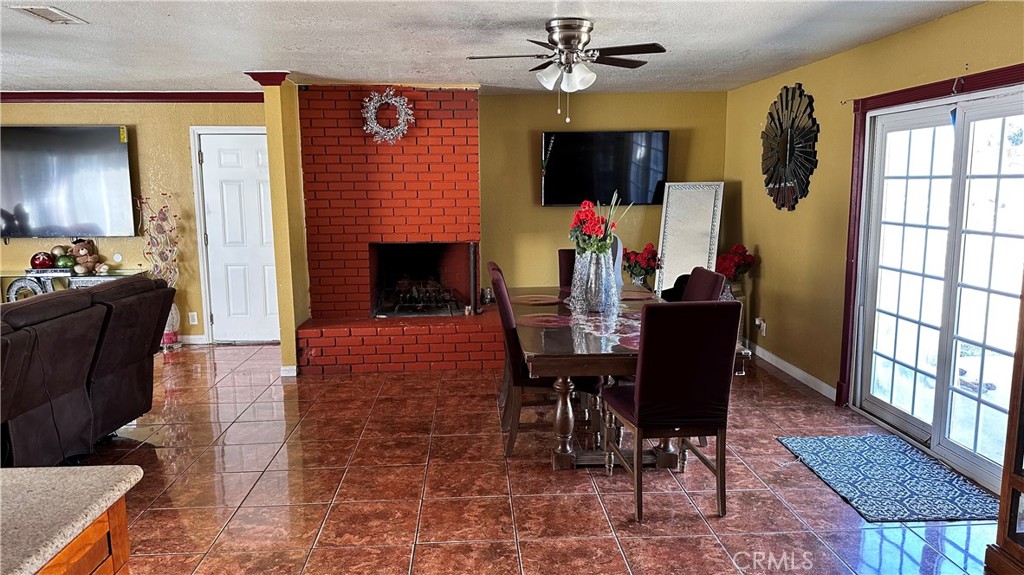 21290 Ellis Avenue Perris, CA 92570 - Photo 10 of 47 a view of a dining room with furniture window and wooden floor