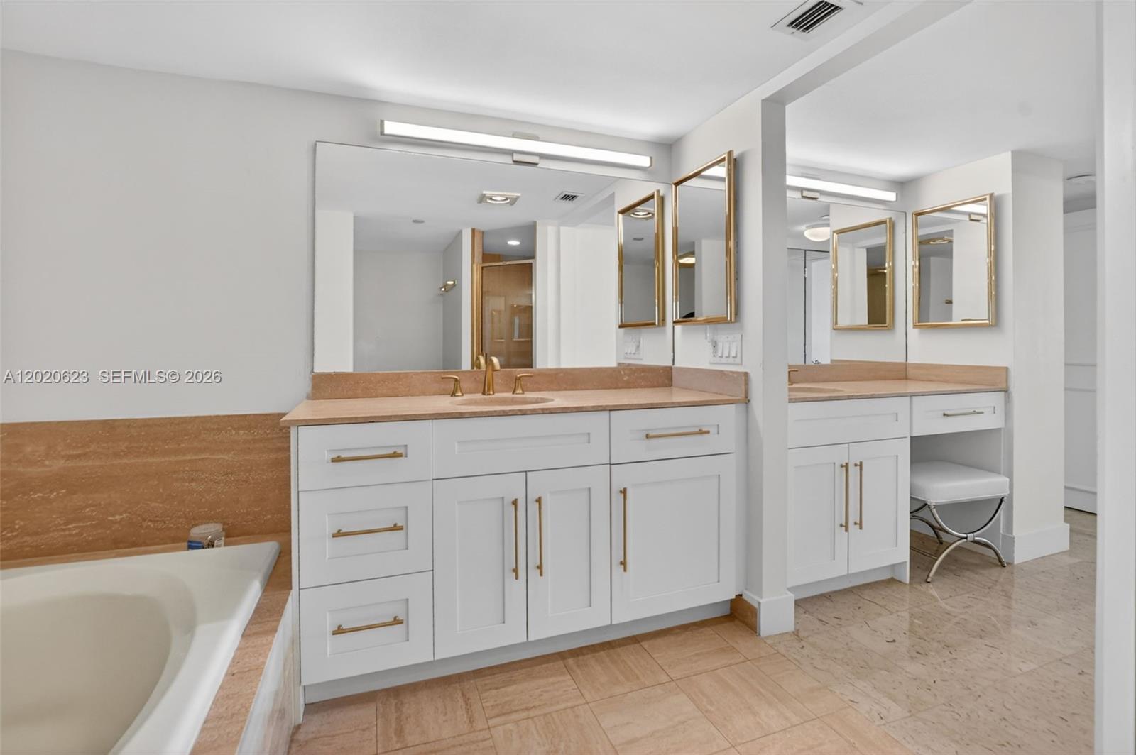4101 North Ocean Boulevard, Unit 1605 Boca Raton, FL 33431 - Photo 26 of 35 a bathroom with a granite countertop sink mirror and bathtub