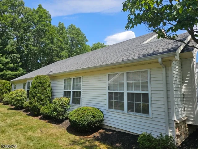 a house with trees in front of it