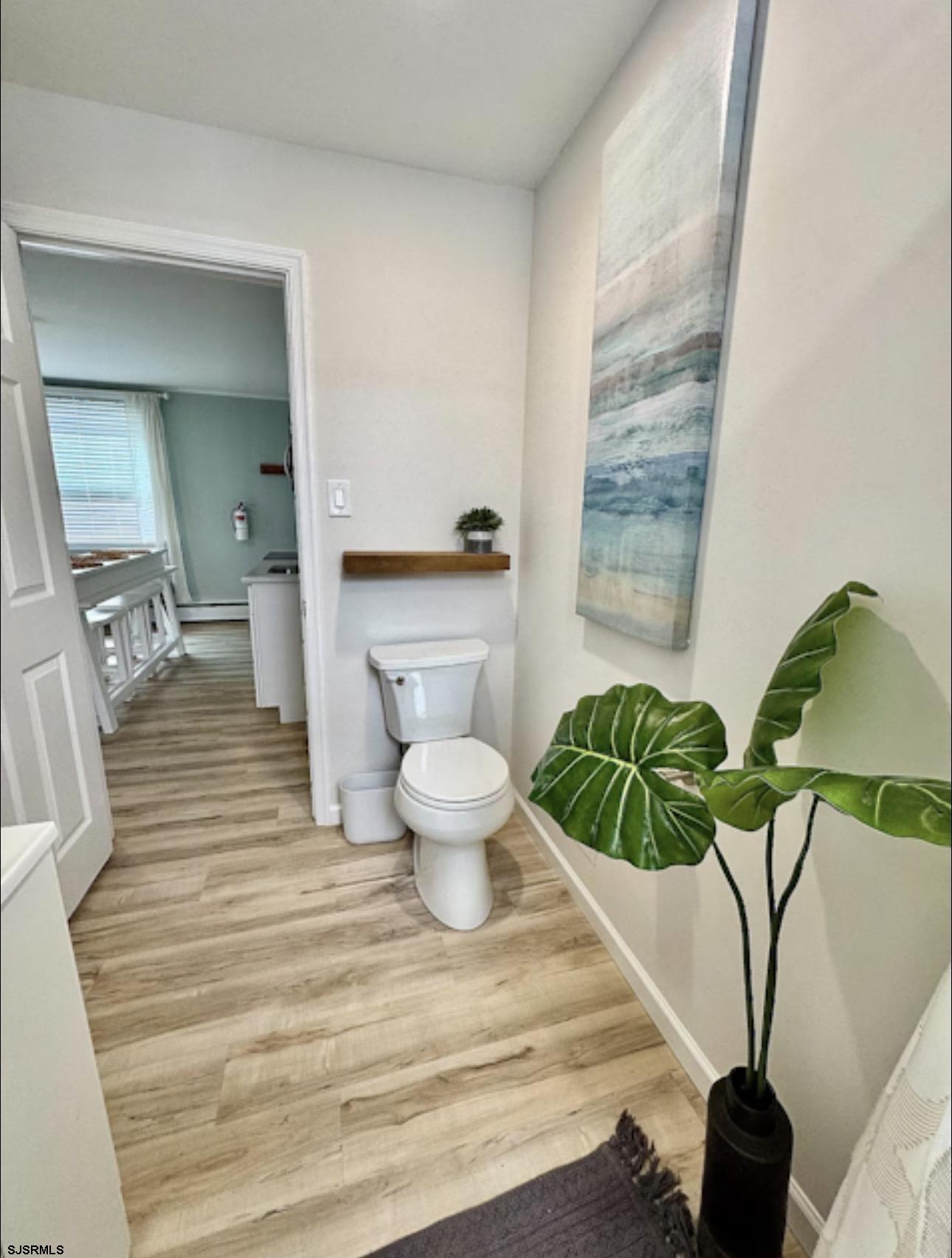 512 West Brigantine Avenue, Unit A Brigantine, NJ 08203 - Photo 15 of 26 a bathroom with a toilet and a mirror