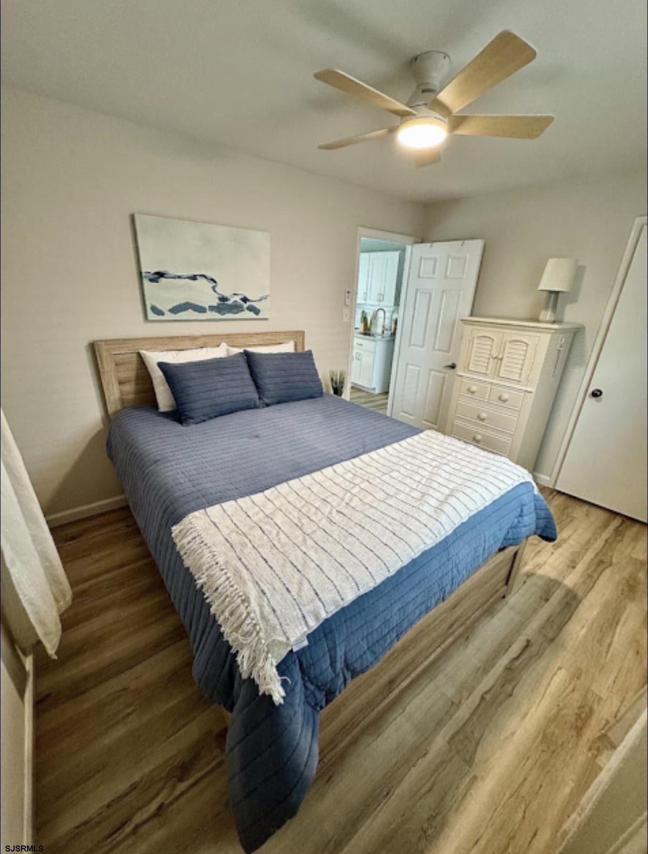 512 West Brigantine Avenue, Unit A Brigantine, NJ 08203 - Photo 16 of 26 a bedroom with a bed and a dresser