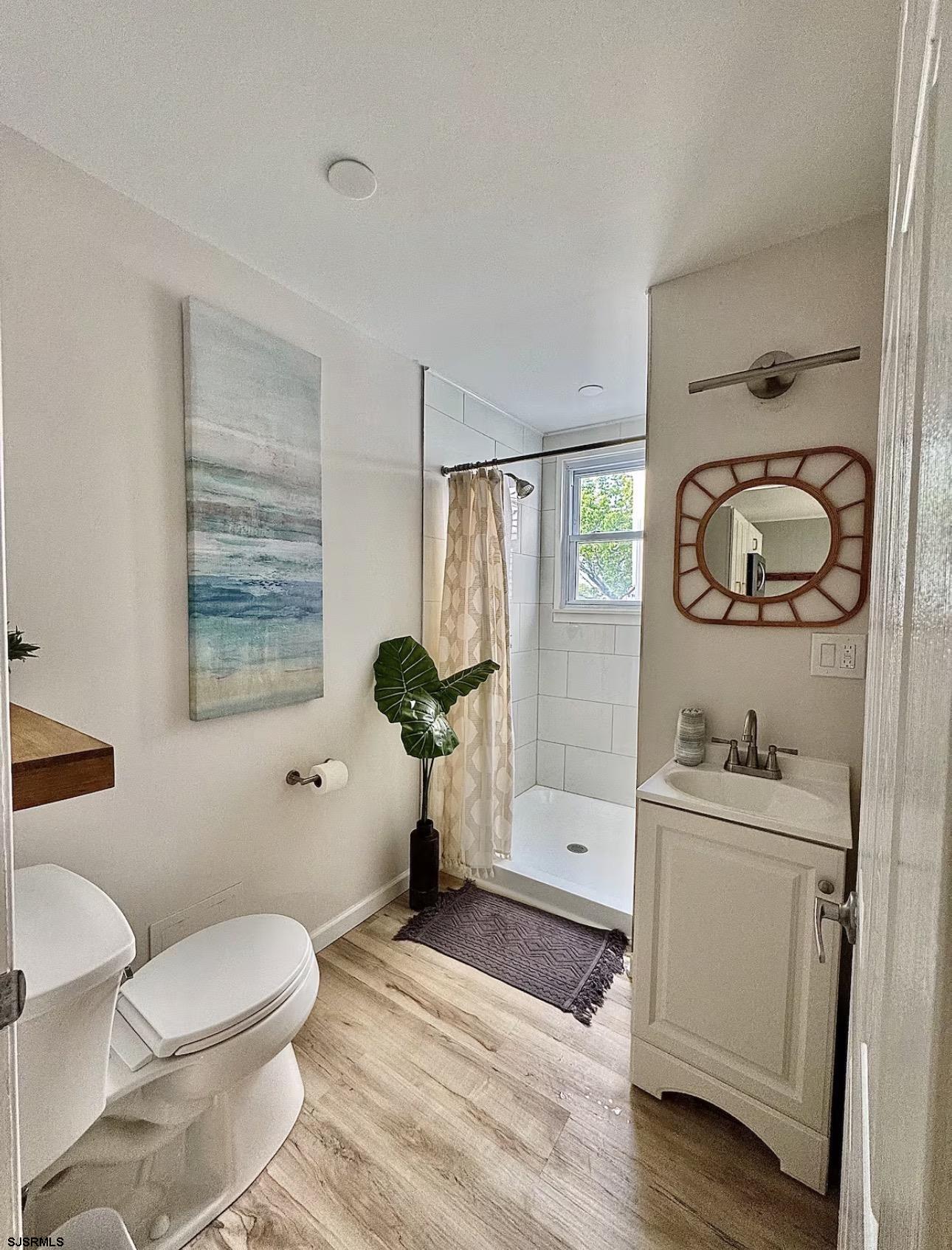 512 West Brigantine Avenue, Unit A Brigantine, NJ 08203 - Photo 17 of 26 a bathroom with a toilet a sink and a bathtub
