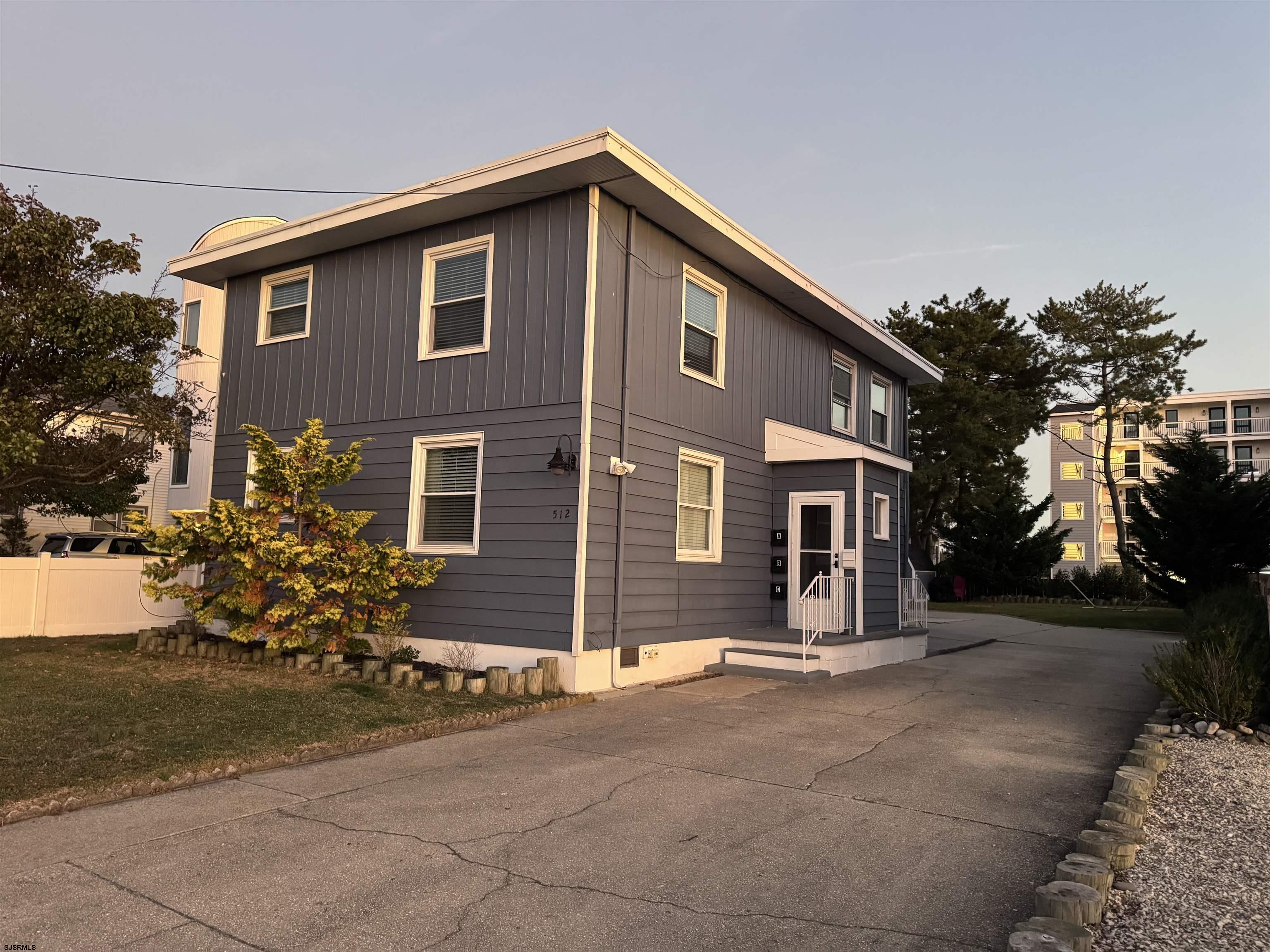 512 West Brigantine Avenue, Unit A Brigantine, NJ 08203 - Photo 26 of 26 a front view of a house with a yard and garage