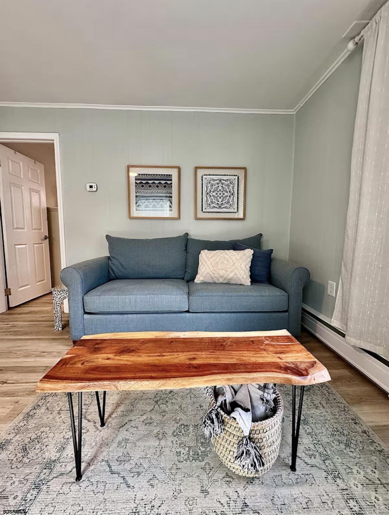 512 West Brigantine Avenue, Unit A Brigantine, NJ 08203 - Photo 7 of 26 a living room with a rug table and a table