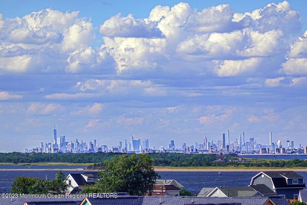 a view of a city with lots of lake and houses in the back
