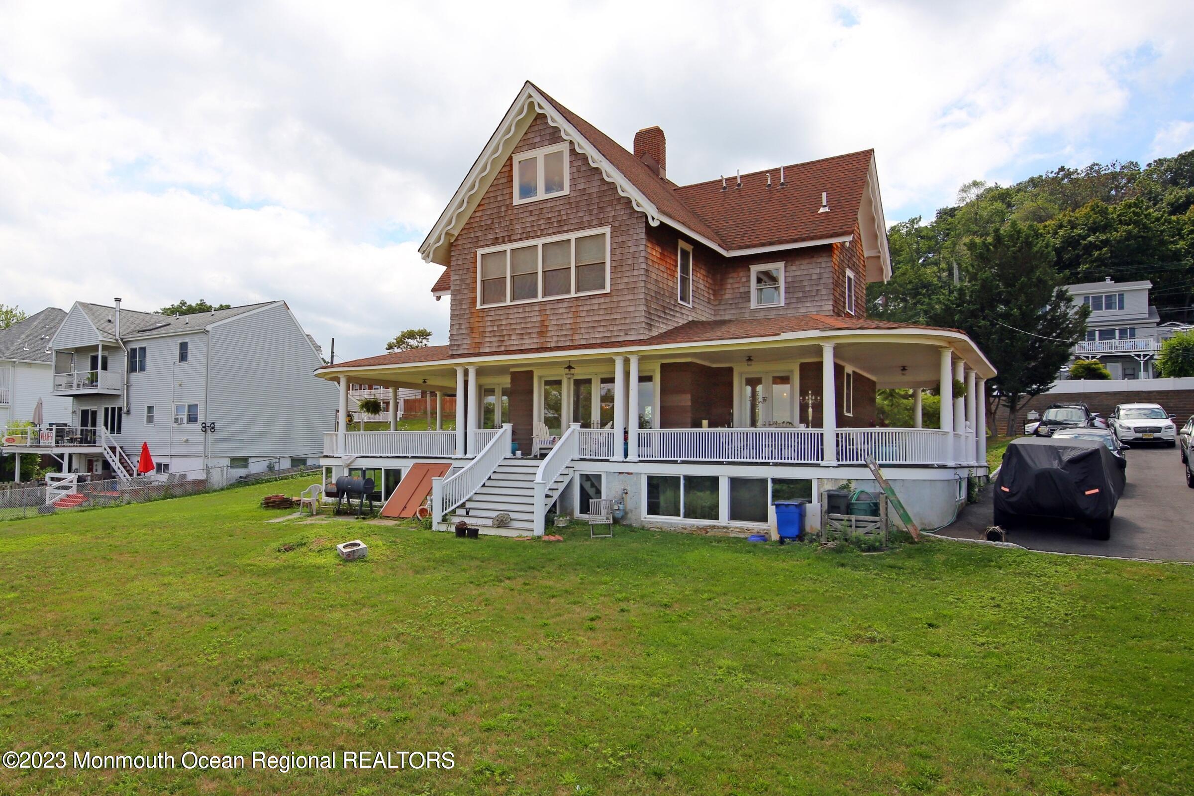 52 Navesink Avenue Highlands, NJ 07732 - Photo 20 of 71 a front view of house with yard and green space