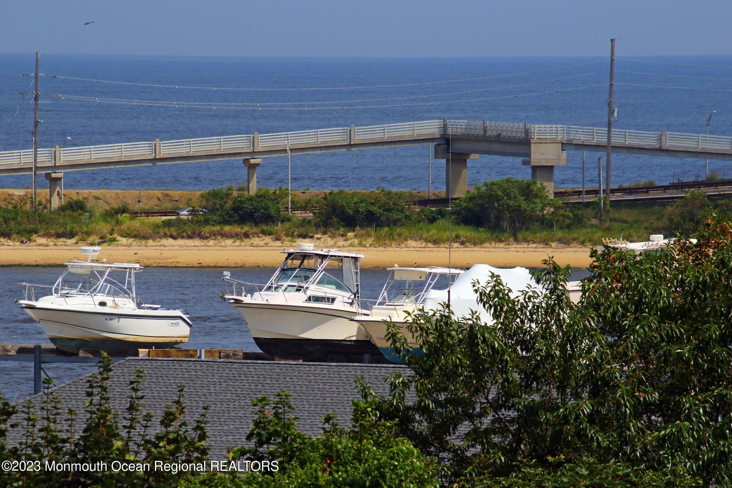 52 Navesink Avenue Highlands, NJ 07732 - Photo 22 of 71 a view of a swimming pool with outdoor seating