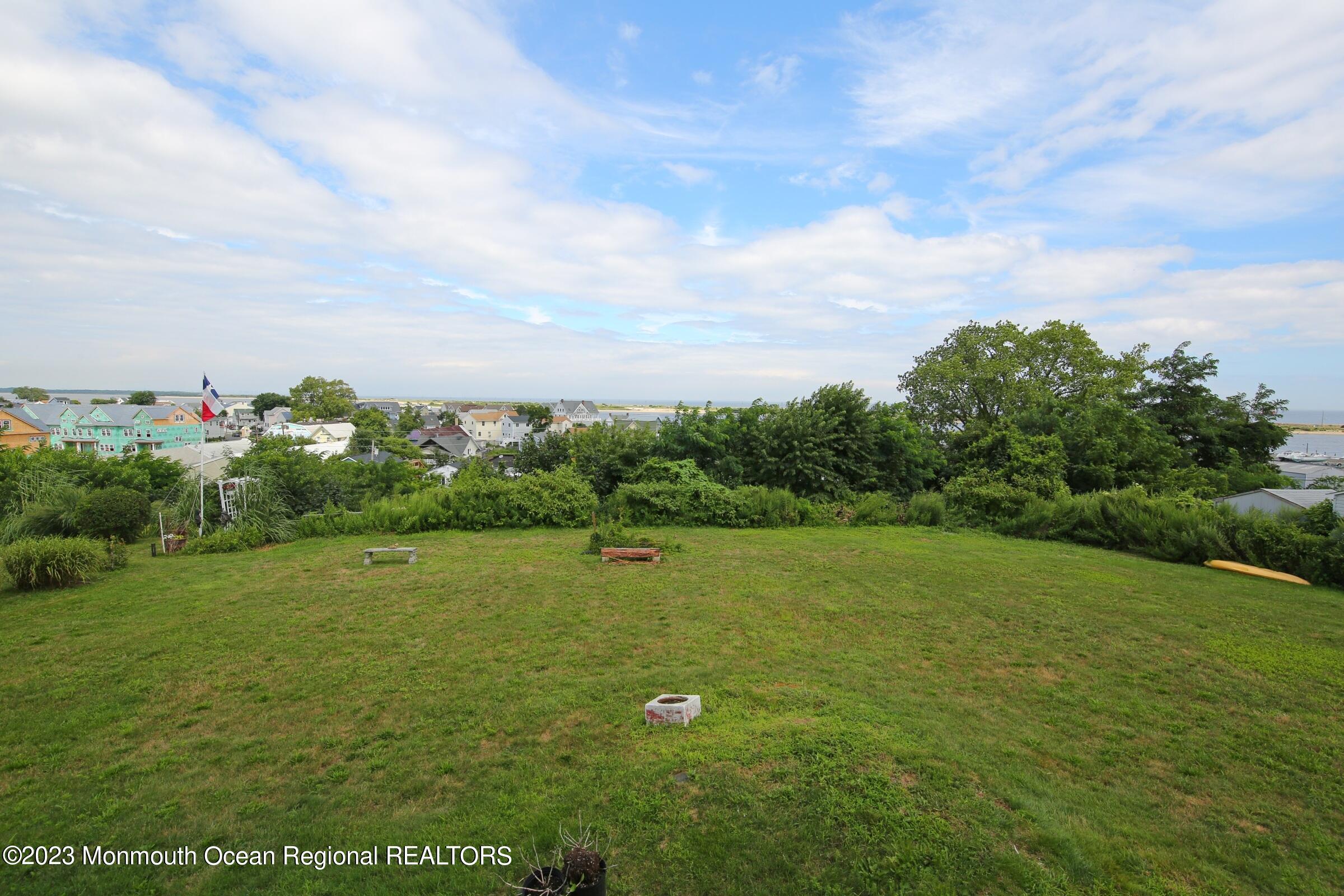 52 Navesink Avenue Highlands, NJ 07732 - Photo 23 of 71 a view of a field with potted plants and sky view