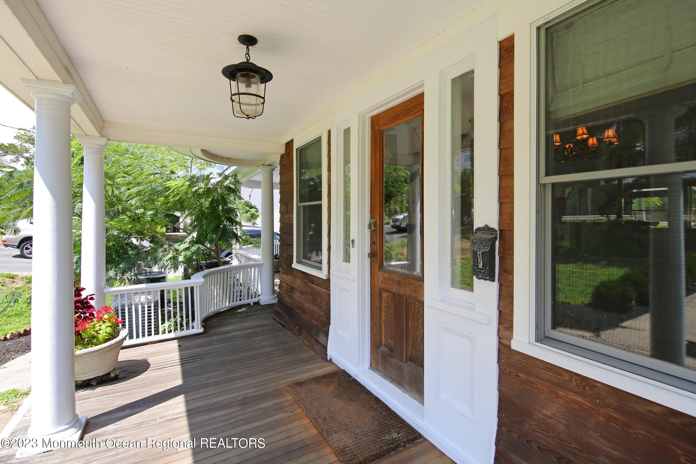 52 Navesink Avenue Highlands, NJ 07732 - Photo 24 of 71 a very nice looking room with a large window and wooden floor