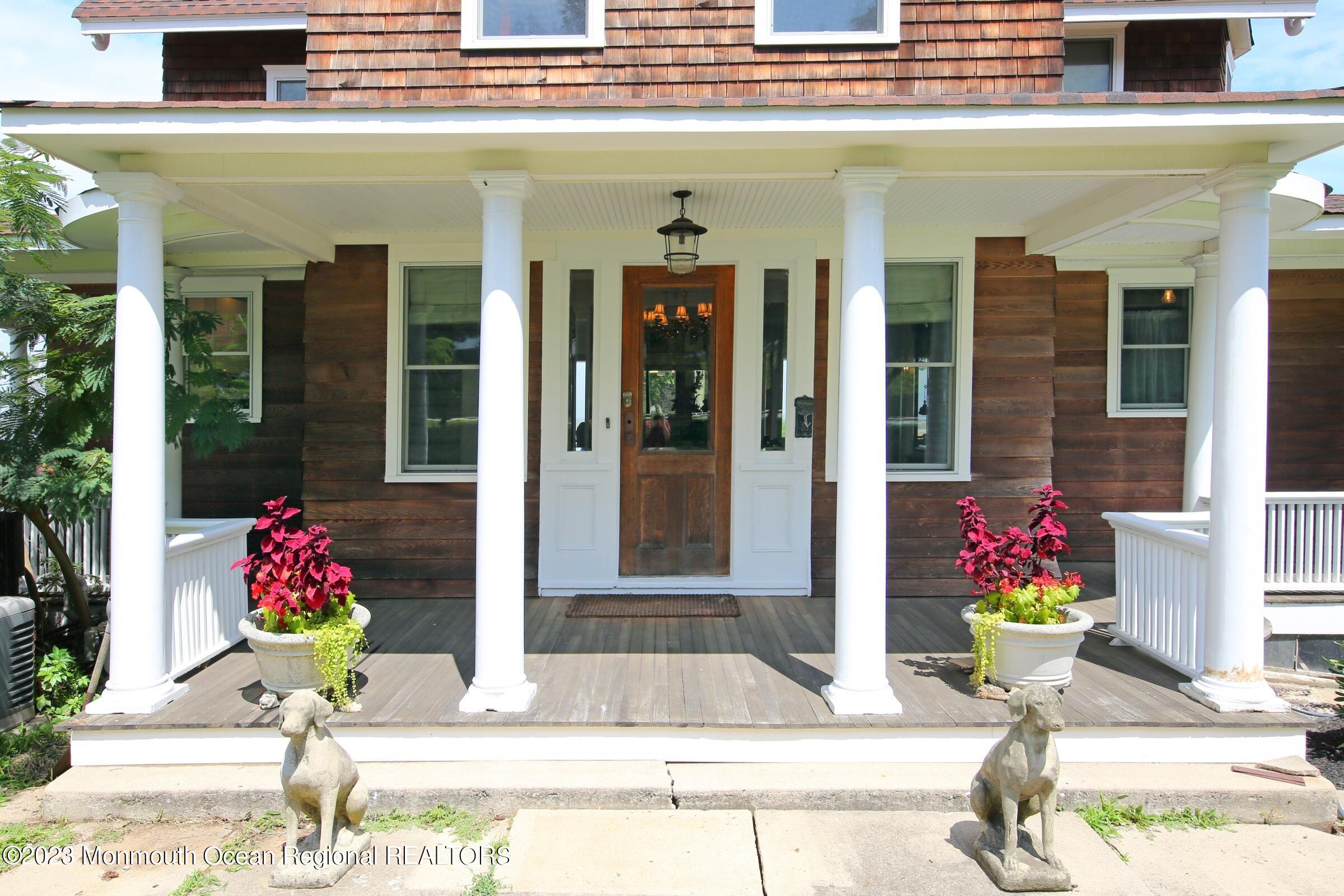 52 Navesink Avenue Highlands, NJ 07732 - Photo 3 of 71 a view of a building with flowers