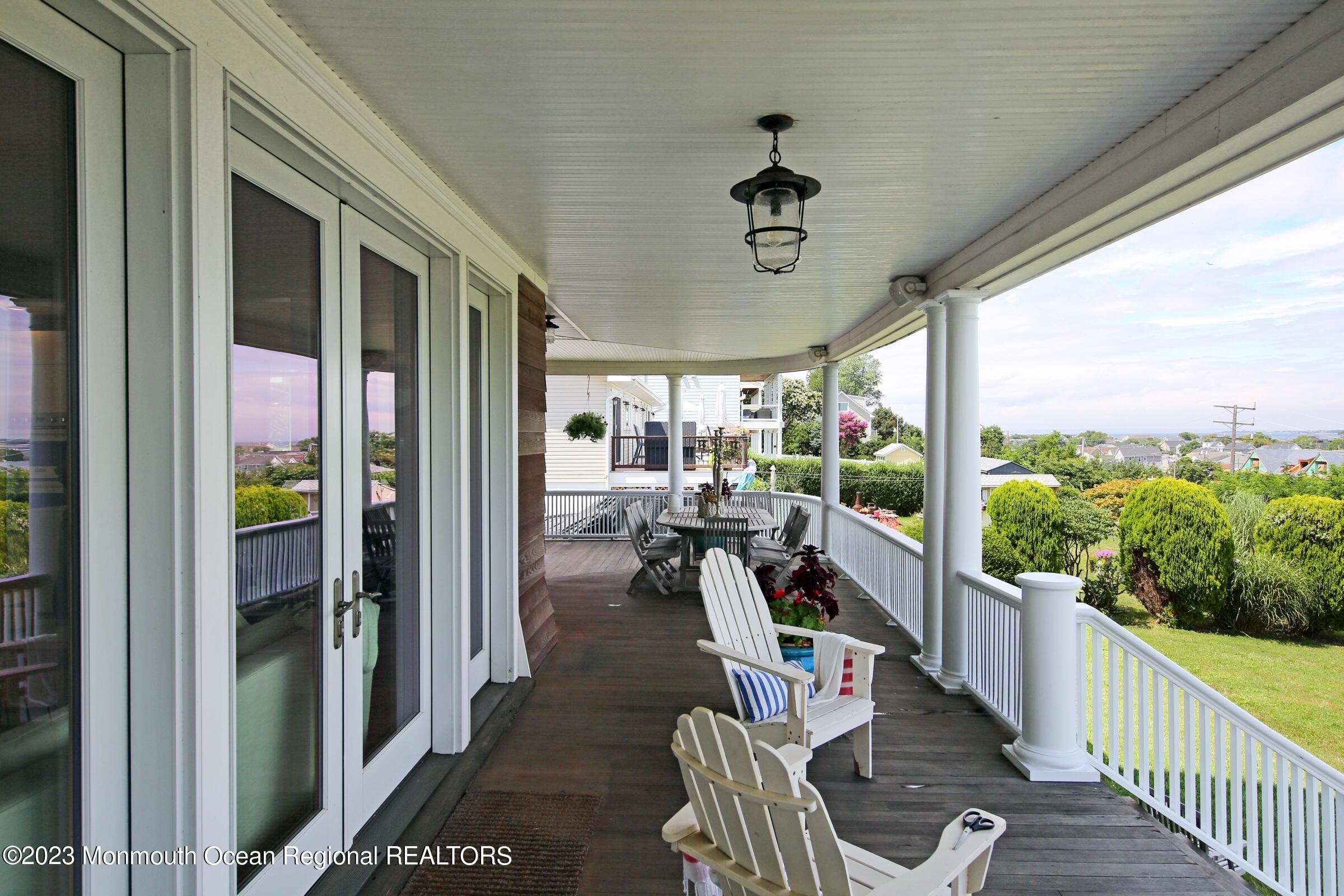 52 Navesink Avenue Highlands, NJ 07732 - Photo 30 of 71 a view of a porch with furniture and garden