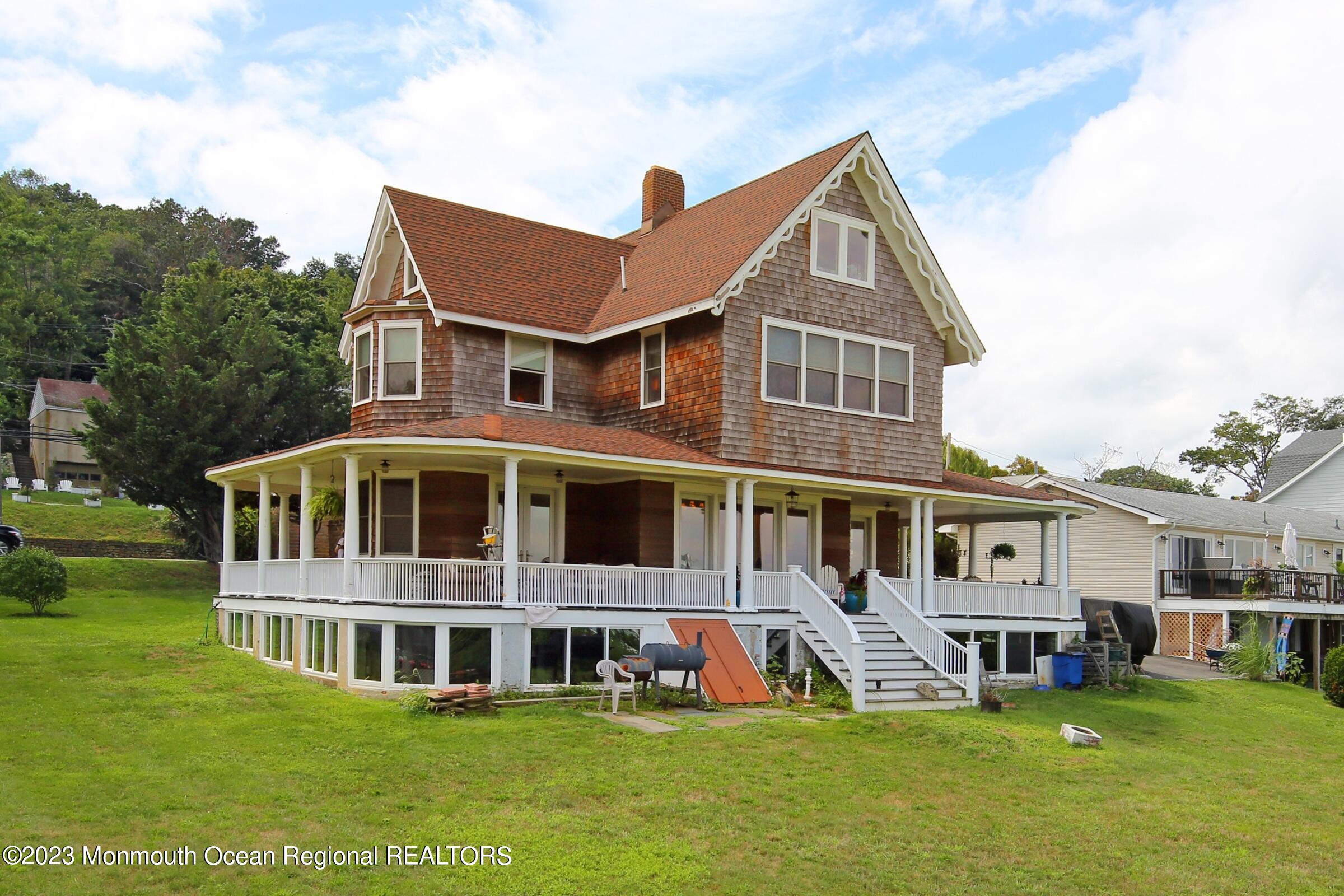 52 Navesink Avenue Highlands, NJ 07732 - Photo 38 of 71 a front view of a building with garden