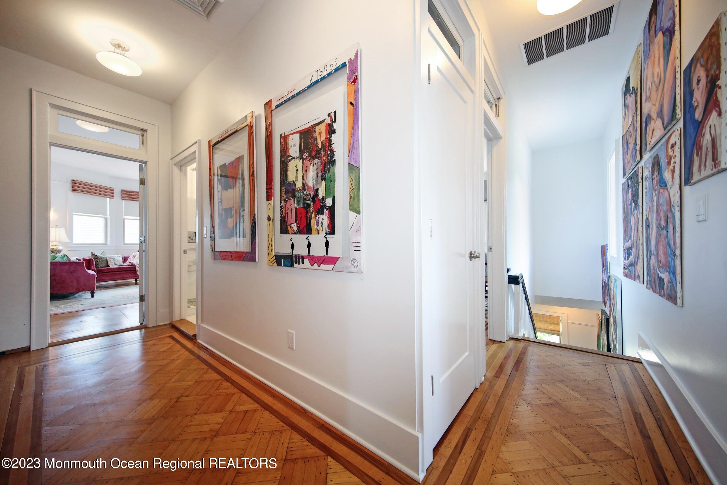 52 Navesink Avenue Highlands, NJ 07732 - Photo 41 of 71 a view of a hallway with bedroom and wooden floor