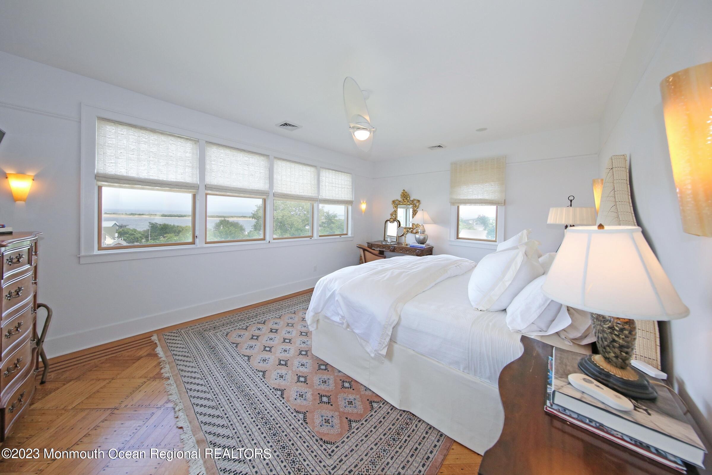 52 Navesink Avenue Highlands, NJ 07732 - Photo 45 of 71 a bedroom with a bed and a window