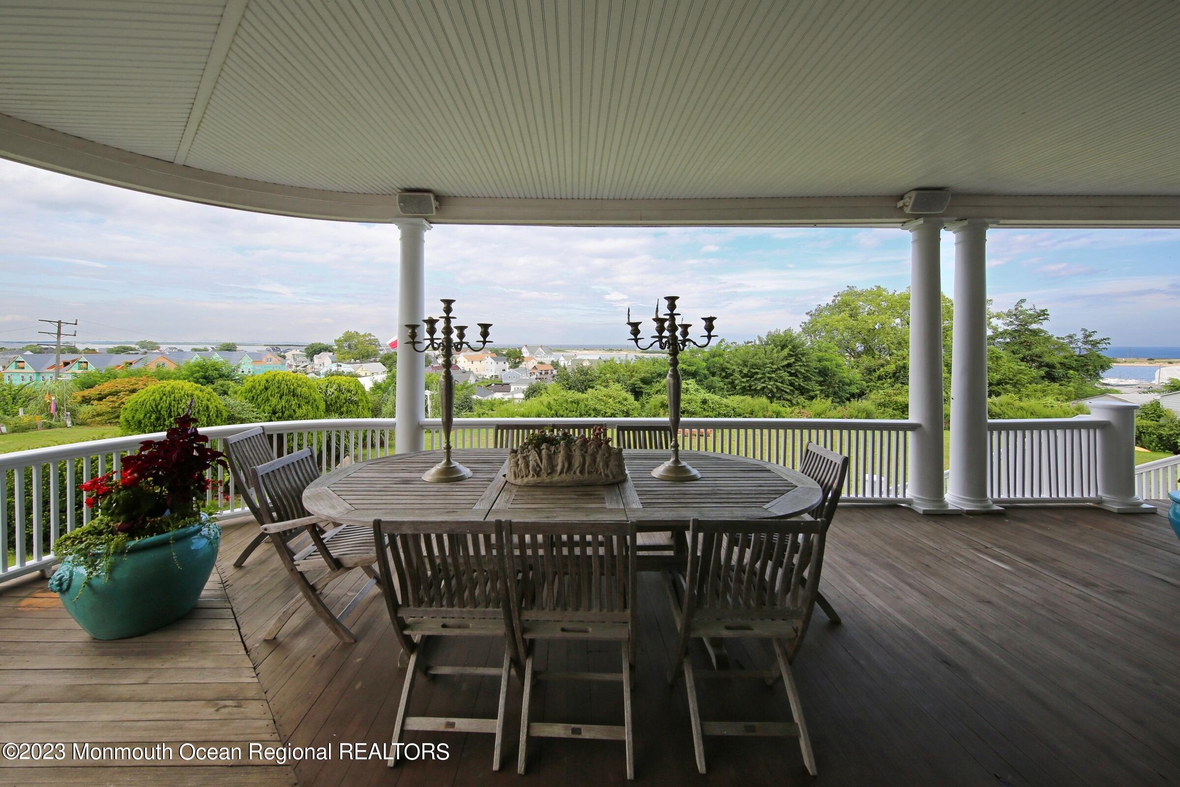 52 Navesink Avenue Highlands, NJ 07732 - Photo 48 of 71 a view of an outdoor dining space with furniture and garden