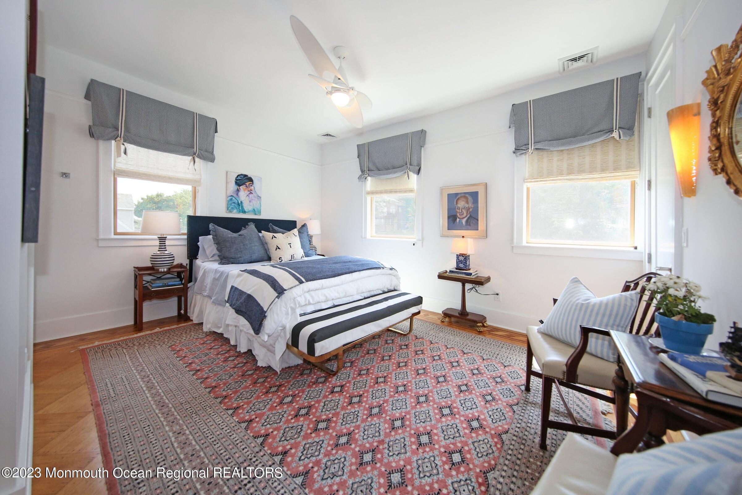 52 Navesink Avenue Highlands, NJ 07732 - Photo 53 of 71 a bedroom with a bed and wooden floor