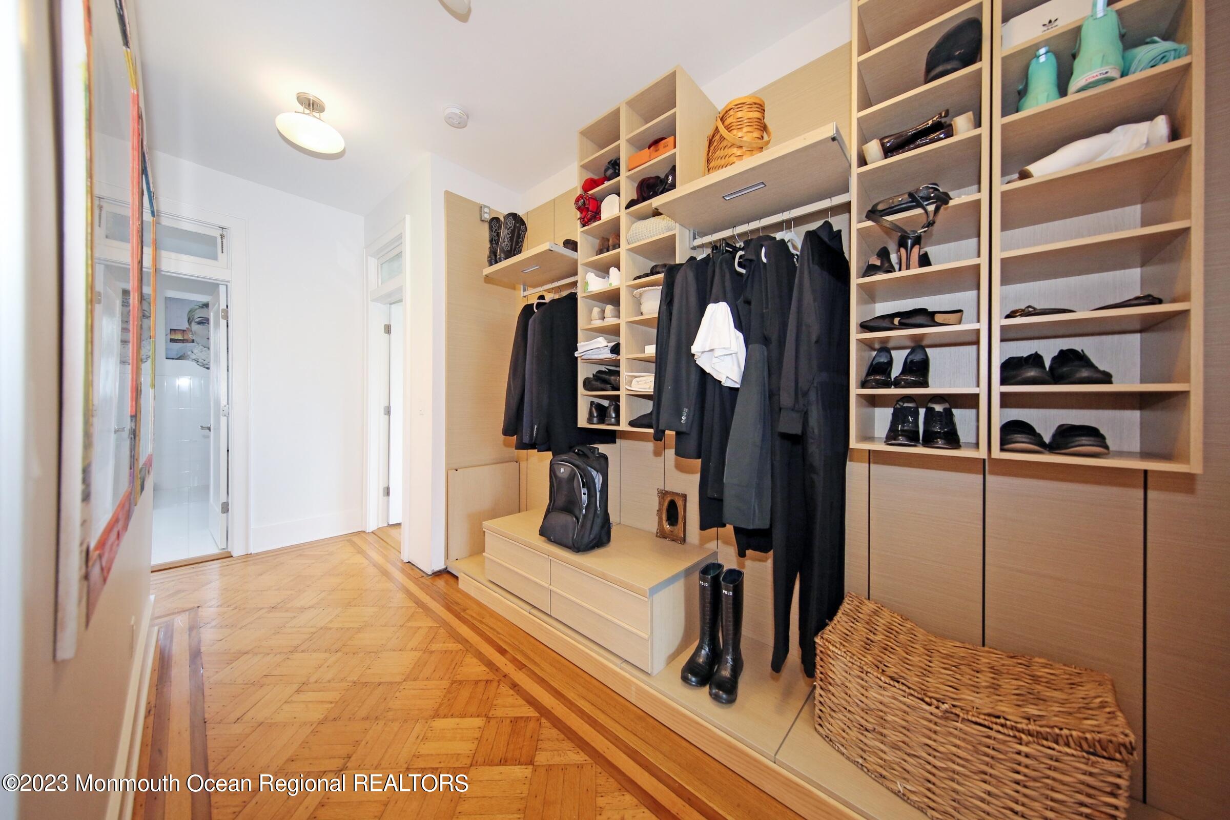 52 Navesink Avenue Highlands, NJ 07732 - Photo 55 of 71 a view of walk in closet with clothes and shoes