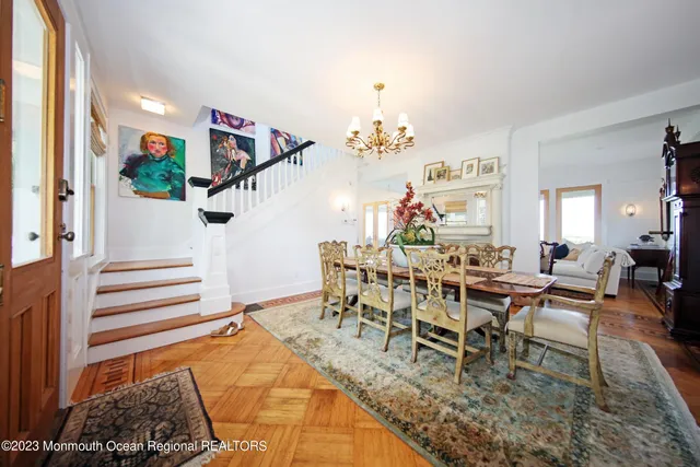 a view of a dining room with furniture and a rug