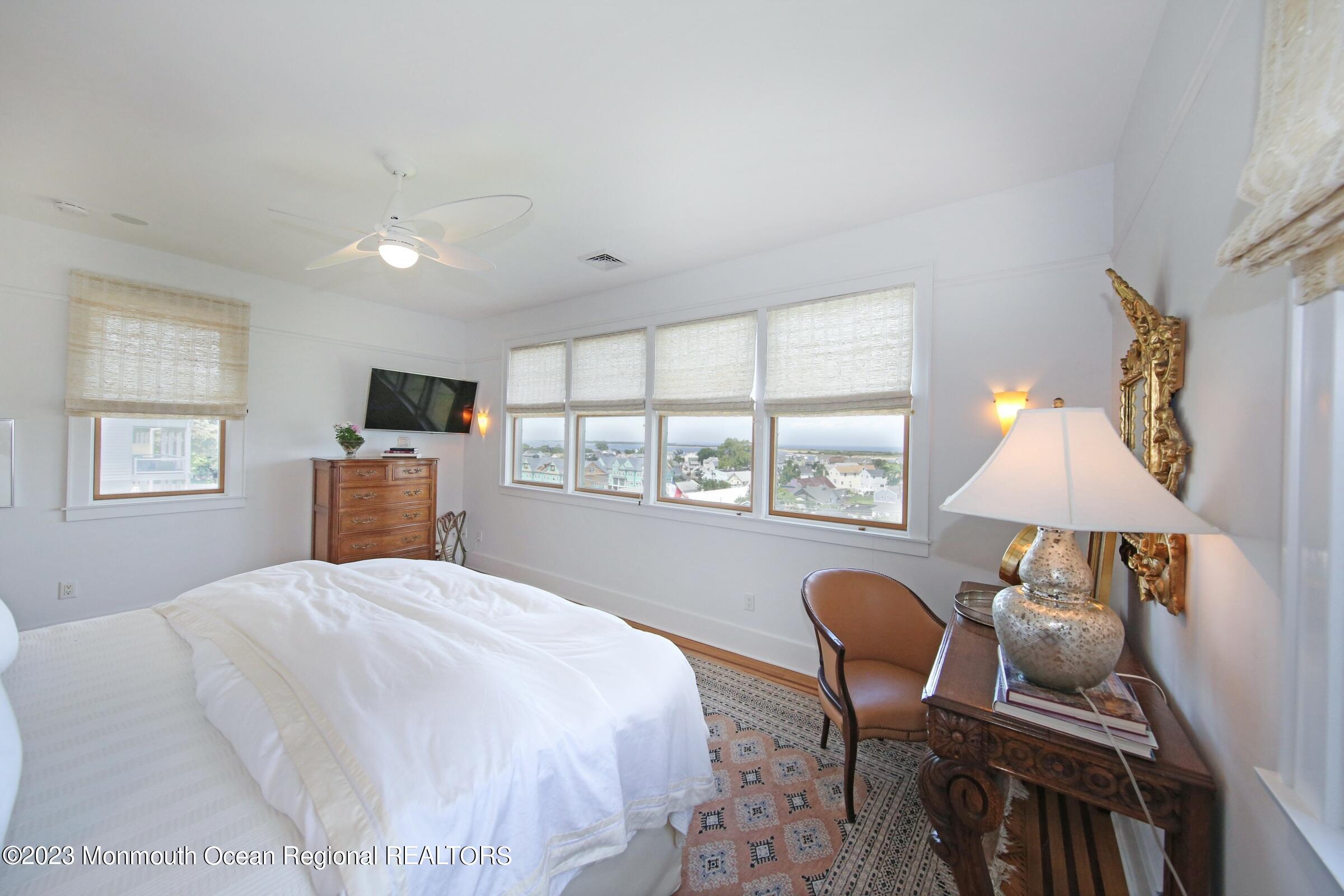 52 Navesink Avenue Highlands, NJ 07732 - Photo 61 of 71 a bedroom with a bed and a flat screen tv