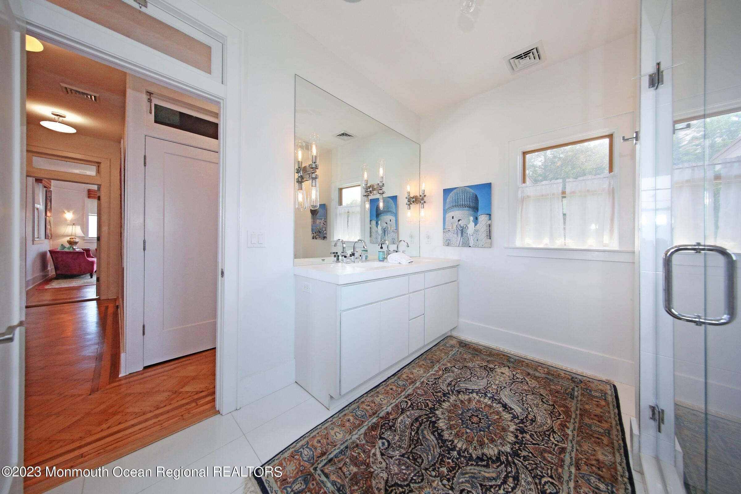 52 Navesink Avenue Highlands, NJ 07732 - Photo 62 of 71 a bathroom with a sink and a mirror