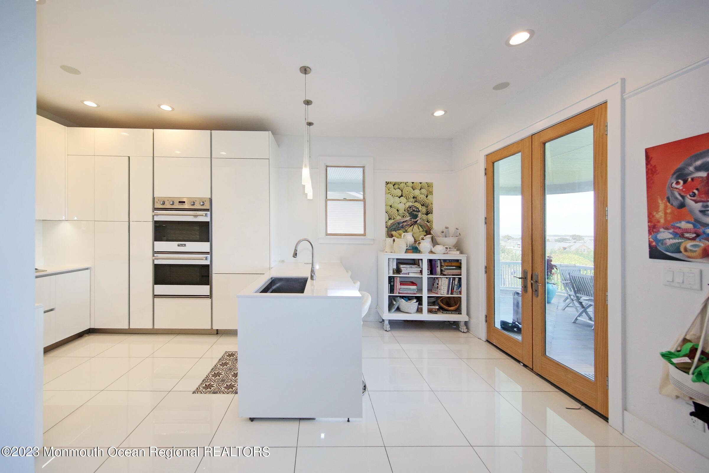 52 Navesink Avenue Highlands, NJ 07732 - Photo 69 of 71 a living room with furniture a large window and stainless steel appliances
