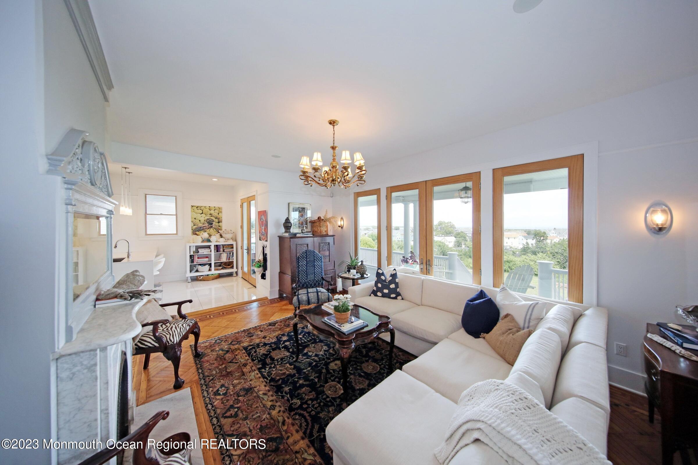 52 Navesink Avenue Highlands, NJ 07732 - Photo 9 of 71 a living room with furniture large window and outdoor view