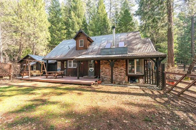 a view of a patio with table and chairs and wooden floor