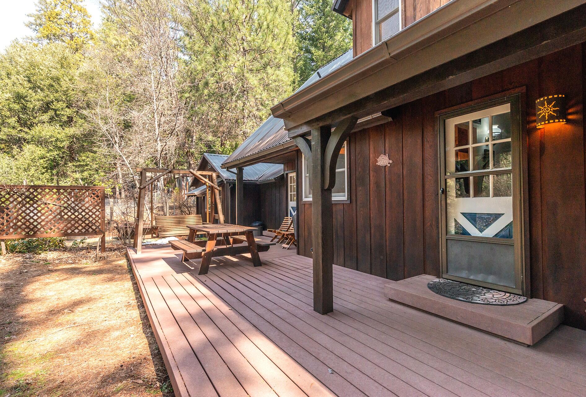 491 East Branch Road Weaverville, CA 96093 - Photo 15 of 59 a view of a patio with table and chairs and wooden floor