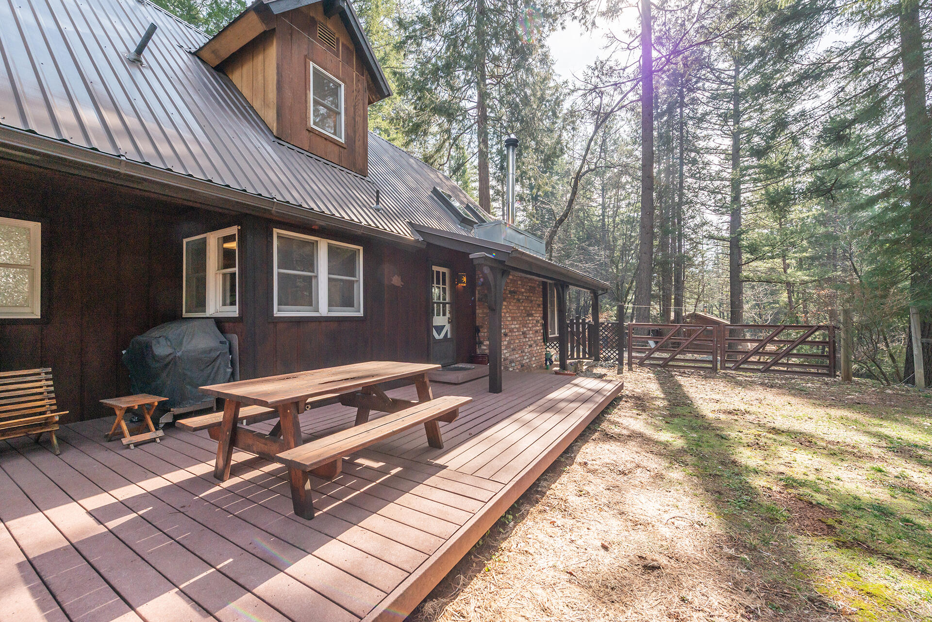 491 East Branch Road Weaverville, CA 96093 - Photo 17 of 59 a backyard of a house with outdoor seating