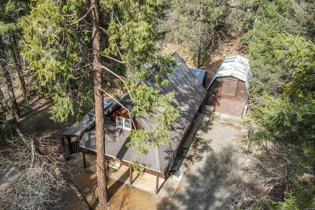 a backyard of a house with lots of green space and trees