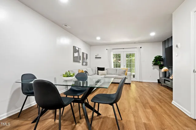 a kitchen with stainless steel appliances a refrigerator sink and cabinets
