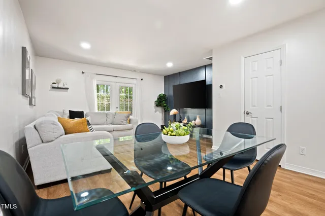 a kitchen with granite countertop stainless steel appliances a stove a sink and a microwave