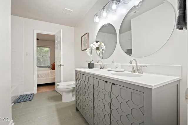a bedroom with a bed and a book shelf