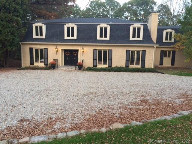 98 Beech Mountain Road Mansfield, CT 06250 - Photo 1 of 1 a view of a brick building next to a yard