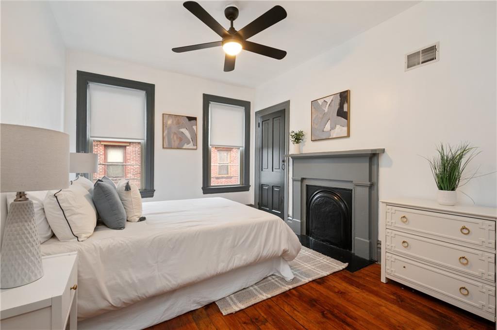 162 Almond Way Pittsburgh, PA 15201 - Photo 13 of 38 a bedroom with a bed and a dresser