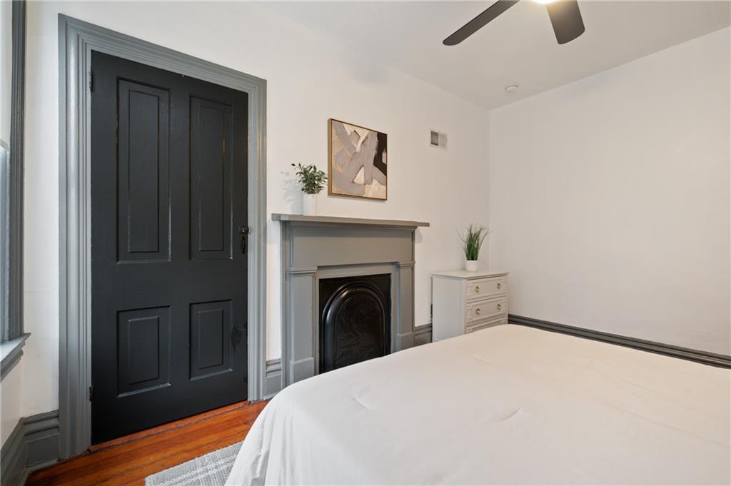 162 Almond Way Pittsburgh, PA 15201 - Photo 15 of 38 a bedroom with a bed and a fireplace