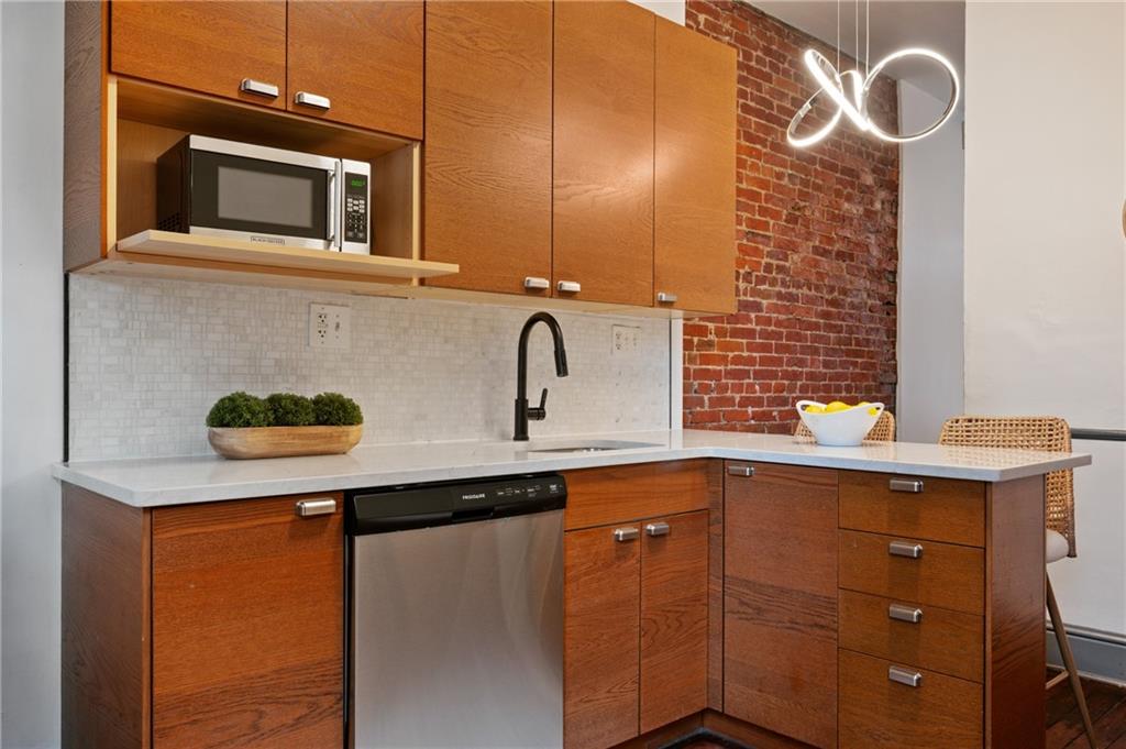 162 Almond Way Pittsburgh, PA 15201 - Photo 9 of 38 a kitchen with a sink and cabinets