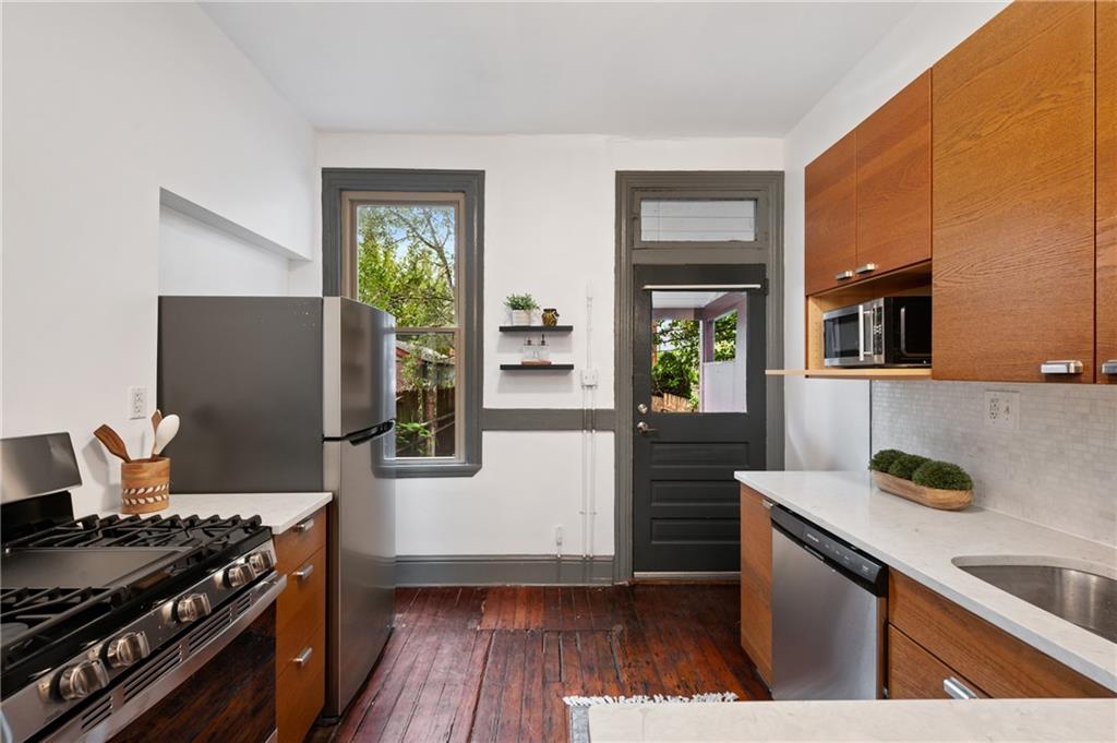 162 Almond Way Pittsburgh, PA 15201 - Photo 10 of 38 a kitchen with stainless steel appliances granite countertop a stove and a refrigerator