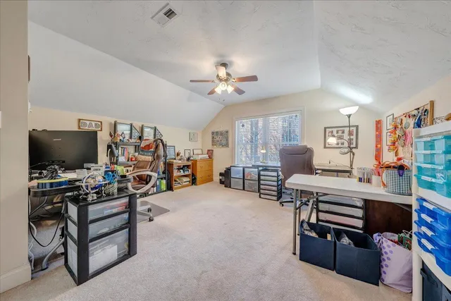 a spacious bathroom with a double vanity sink a toilet and a mirror