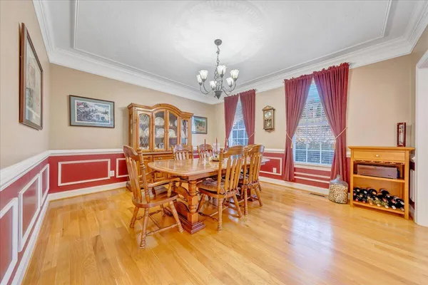 a living room with furniture and a book shelf