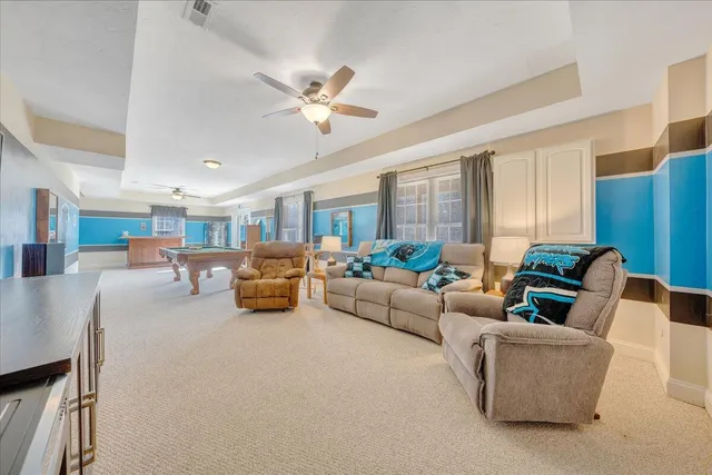 a living room with furniture and a table
