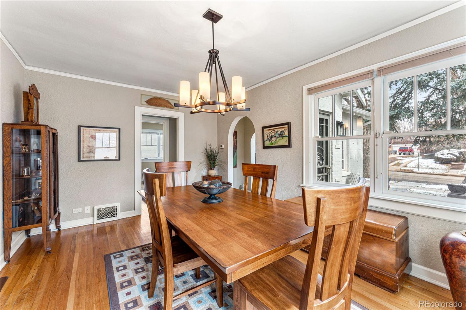 1639 Grape Street Denver, CO 80220 - Photo 11 of 39 a view of a dining room with furniture window and wooden floor